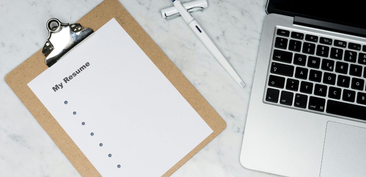 Professional writing a CV with career coaching support